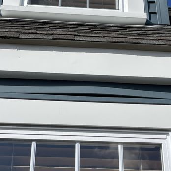 Eagle Exteriors - Buckle in siding after fixing. - Roofing Near Me - Cumberland, Rhode Island