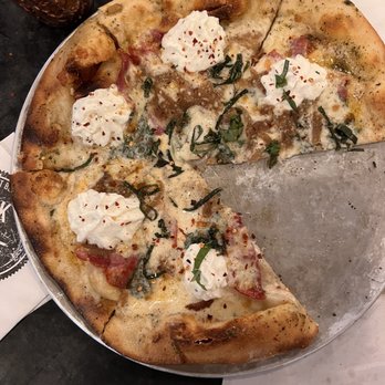 Oak and Stone - White pizza with spinach and capilioa on a fire roasted crust. - Pizza Near Me - Naples, Florida