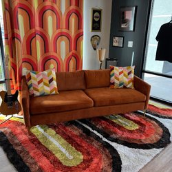 Rock This Town Records - Chill out, talk music, or even pick up our guitar and plug-in. The legendary orange couch awaits.