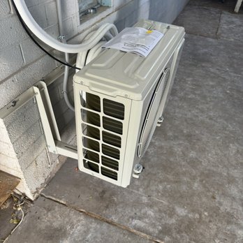 RG's and Son's Electric Force - Outdoor portion of mini split, tucked away so it's not an eyesore. - Electricians Near Me