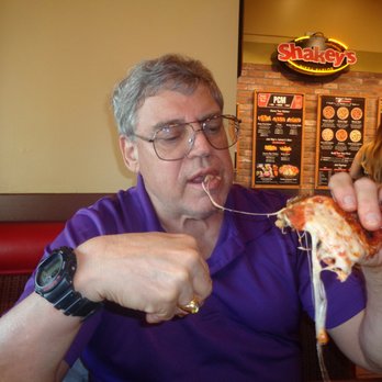 Shakey's Pizza Parlor - Handling a Slice of Gooey Pizza - Pizza Near Me - Redlands, California Shakey's Pizza Parlor - Handling a Slice of Gooey Pizza - Pizza Near Me - Redlands, California