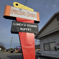 Pizza Den - Close-up of the business sign of Pizza Den.