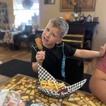 Three Bear's Cafe - Kiddo eating the corn dog - Breakfast & Brunch Near Me - Heber-Overgaard, Arizona