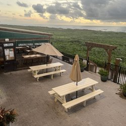 The Palms Resort - View of restaurant and beach from second floor