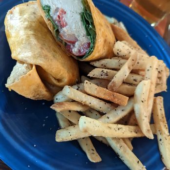 Tortuga's Lie - Hummus wrap with Island fries. - Seafood Near Me - Nags Head, North Carolina Tortuga's Lie - Hummus wrap with Island fries. - Seafood Near Me - Nags Head, North Carolina