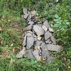 P&M Asphalt Paving - Broken pieces of old asphalt dumped on my property.