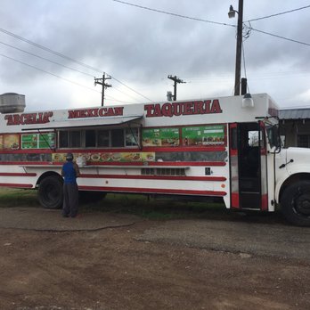 Arcelia Mexican Taqueria - a woman standing in front of a food truck - Food Trucks Near Me - Hempstead, Texas
