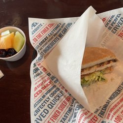 Becks Prime - Half of a grilled chicken sandwich and a fresh fruit cup.