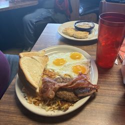 Diner 31 - The big breakfast.  Three meat ham sausage bacon.  Biscuit and gravy, toast and a plate full of hash browns.