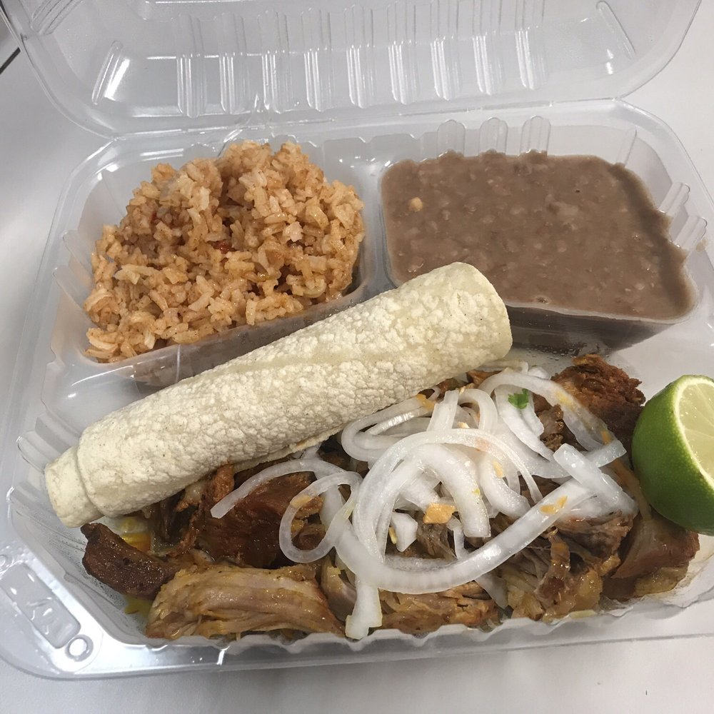 Cochinta Pibil with some rice, beans, two warm tortillas, lime, and lemon soaked onions with some habanero peppers. DELICIOUS!!! Cochinta Pibil with some rice, beans, two warm tortillas, lime, and lemon soaked onions with some habanero peppers. DELICIOUS!!!