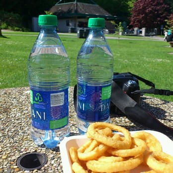 Lumbermen's Arch Cafe - a plate of onion rings and a bottle of water - Fast Food Near Me - Vancouver, British Columbia Lumbermen's Arch Cafe - a plate of onion rings and a bottle of water - Fast Food Near Me - Vancouver, British Columbia