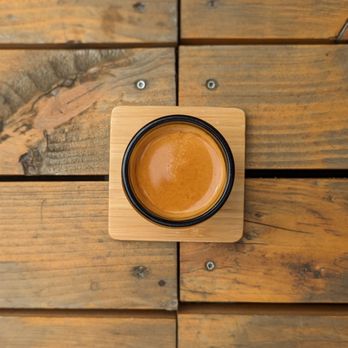 Onyx Tonics - a cup of coffee on a wooden table - Coffee & Tea Near Me - Burlington, Vermont Onyx Tonics - a cup of coffee on a wooden table - Coffee & Tea Near Me - Burlington, Vermont