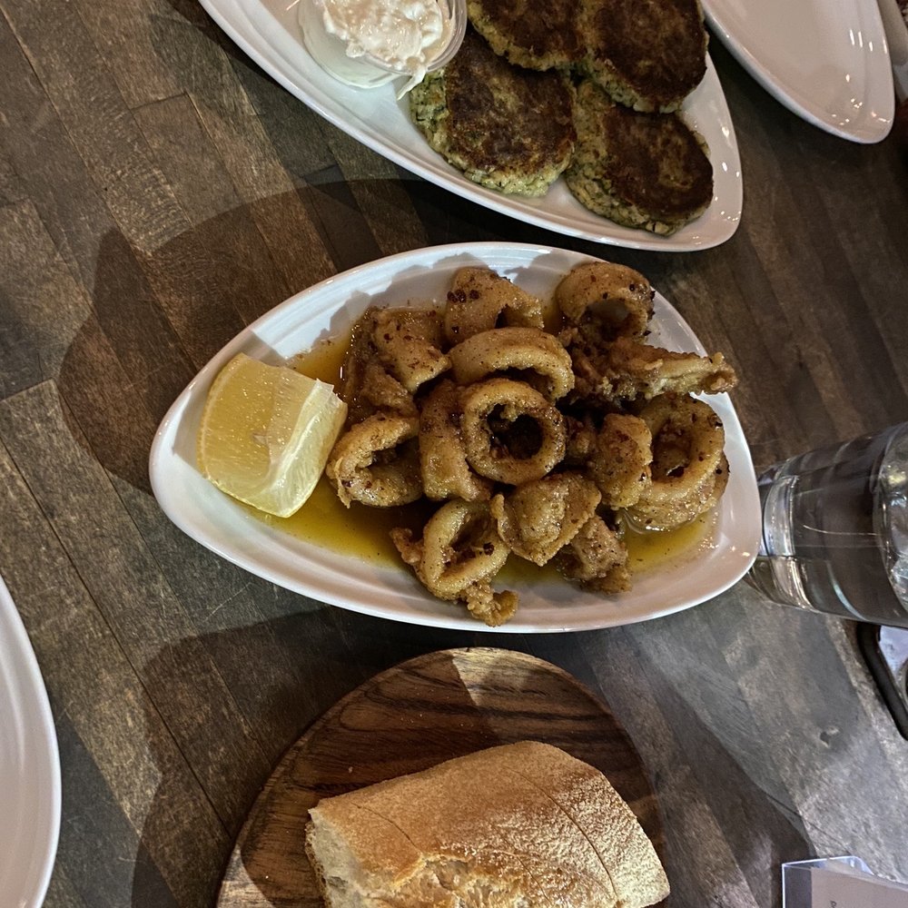 Zuccini cakes and sautéed calamari Zuccini cakes and sautéed calamari