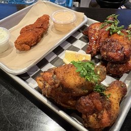 Nashville Hot Chicken Tender, Pineapple Basil Chicken Wings (top/back), Lemon Pepper Chicken Wings (bottom/front) Nashville Hot Chicken Tender, Pineapple Basil Chicken Wings (top/back), Lemon Pepper Chicken Wings (bottom/front)