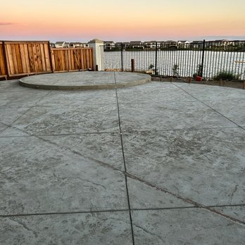 Juma Construction - a concrete patio with a fire hydrant - General Contractors Near Me