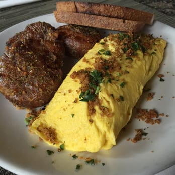 Lola - omelette. like the name suggest, it's a normal omelette but well cooked. - Greek Near Me - Seattle, Washington Lola - omelette. like the name suggest, it's a normal omelette but well cooked. - Greek Near Me - Seattle, Washington