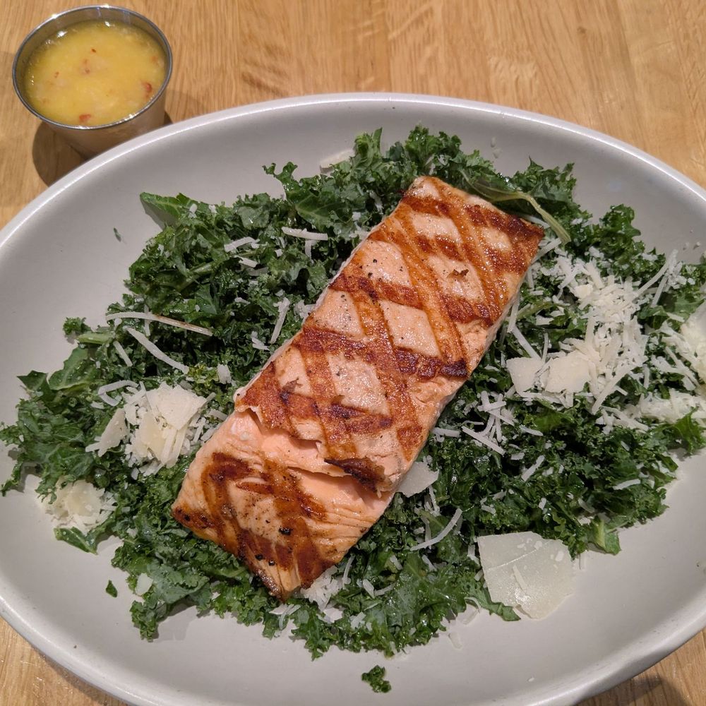 Tuscan Salmon kale salad with a light lemon and ginger refreshing dressing