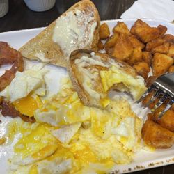 Breakfast / eggs over medium,  artisan roast and the potatoes  yummy!