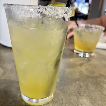 Shotzee's Bar & Grill - The tall margarita is habanero infused and it's nice and spicy and the short one is a margarita on the rocks and just as good! - Pubs Near Me - Keller, Texas Shotzee's Bar & Grill - The tall margarita is habanero infused and it's nice and spicy and the short one is a margarita on the rocks and just as good! - Pubs Near Me - Keller, Texas