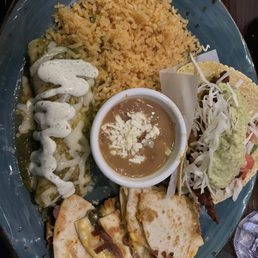 Combo plate with enchilada suizas, chicken milanesa taco, and quesadilla Guadalajara Combo plate with enchilada suizas, chicken milanesa taco, and quesadilla Guadalajara
