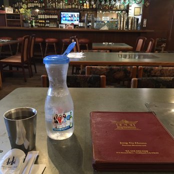 Jong Ga House - My water and menu. Nice  bar in front with flat screen  tv. Nice layout. - Korean Near Me - Oakland, California