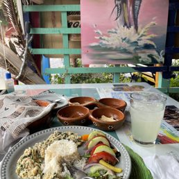 Margarita on the rocks and the cilantro/garlic crab dish with coconut rice and a side salad