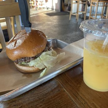 Craft Burger - The Craft Burger with an orange juice. - Burgers Near Me - Placentia, California