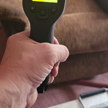 Michigan Bed Bug Specialists - checking room temperature - Pest Control Near Me Michigan Bed Bug Specialists - checking room temperature - Pest Control Near Me