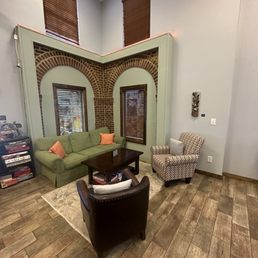 a living room with a green couch
