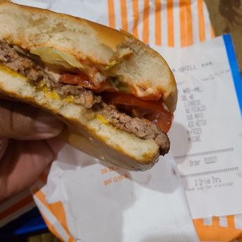 Whataburger - a person holding a sandwich - Fast Food Near Me - Harker Heights, Texas Whataburger - a person holding a sandwich - Fast Food Near Me - Harker Heights, Texas