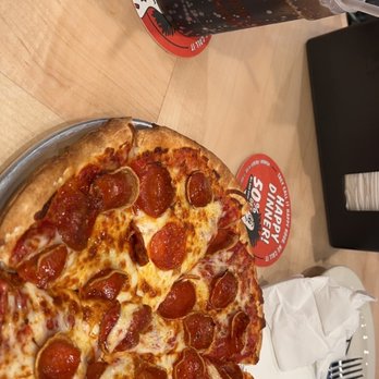 Hideaway Pizza - a pepperoni pizza and soda - Italian Near Me - Norman, Oklahoma