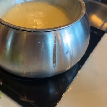 Melting Pot - Dirty pot with chocolate dried on it - Fondue Near Me - St. Petersburg, Florida Melting Pot - Dirty pot with chocolate dried on it - Fondue Near Me - St. Petersburg, Florida