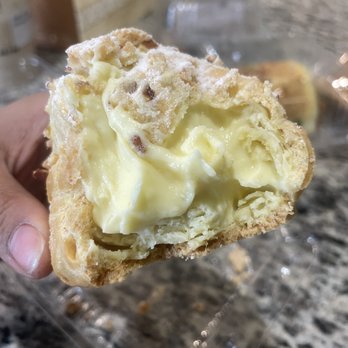 HAMU Bakery - Cream puff closeup you can see size comparison to my hand! - Bakeries Near Me - Overland Park, Kansas HAMU Bakery - Cream puff closeup you can see size comparison to my hand! - Bakeries Near Me - Overland Park, Kansas