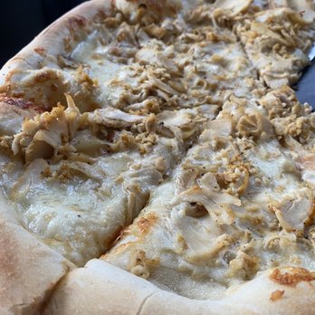 Skipolini's Pizza - We made our own pizza with white sauce, roasted garlic and chicken. It was delicious - Food Delivery Services Near Me - Concord, California