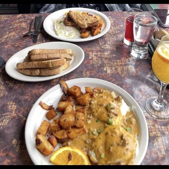 Betty's - 2 eggs your way with rye toast and home fries Biscuits and gravy  Cranberry juice  Orange juice mimosa - New American Near Me - Buffalo, New York