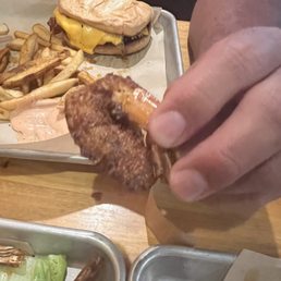 This is one of the five measly pieces of shrimp in the $17 appetizer.  Don't waste your money.