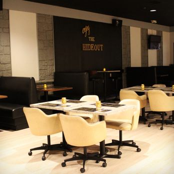 The Hide-Out Bistro & Grill - tables and chairs in a restaurant - American Near Me - Cedar Rapids, Iowa The Hide-Out Bistro & Grill - tables and chairs in a restaurant - American Near Me - Cedar Rapids, Iowa
