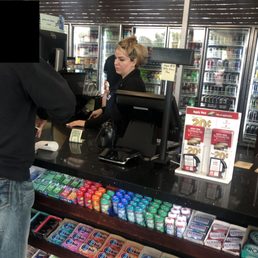 Very rude 40ish something year old female cashier with heavy make up on her cheeks to cover up her bad skin