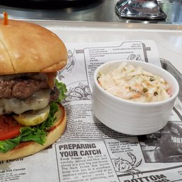 a burger and a side of coleslaw