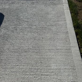 MJL Lawncare - A close picture of a portion of brushed concrete patio - Landscaping Near Me MJL Lawncare - A close picture of a portion of brushed concrete patio - Landscaping Near Me