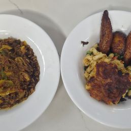 Oxtail with rice underneath. Mac and cheese and plantains as sides. Oxtail with rice underneath. Mac and cheese and plantains as sides.