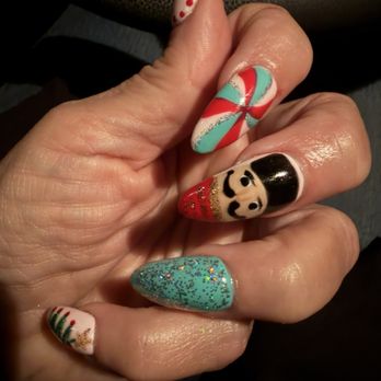 Bella Spa & Nails - Acrylic nail set with gel polish designs featuring a nutcracker and candy in vintage Christmas colors. - Nail Salons Near Me - Burleson, Texas Bella Spa & Nails - Acrylic nail set with gel polish designs featuring a nutcracker and candy in vintage Christmas colors. - Nail Salons Near Me - Burleson, Texas