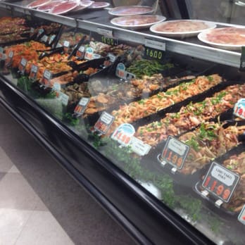 Oki's Seafood Corner - Bottom row, all kinds of Poke. Top row, fresh slices of sashimi! - Seafood Near Me - Kahului, Hawaii Oki's Seafood Corner - Bottom row, all kinds of Poke. Top row, fresh slices of sashimi! - Seafood Near Me - Kahului, Hawaii