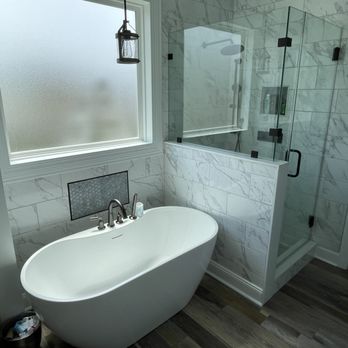 Mooney Remodeling - Custom walk in shower with custom glass and a deep soaking tub with large tile and new flooring - Tiling Near Me Mooney Remodeling - Custom walk in shower with custom glass and a deep soaking tub with large tile and new flooring - Tiling Near Me