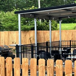 Spoonys - Outdoor seating and meat smoking area