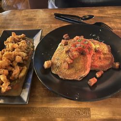 Brass Buckle Grill & Social - Pork belly with savory pancakes "Outlaws crispy pork belly". And fried crawfish in Étouffée sauce.