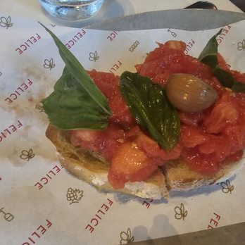 Felice Flatiron - BRUSCHETTA crushed tomato, garlic, sea salt, homemade toasted bread, Felice extra virgin olive oil - Italian Near Me - New York, New York Felice Flatiron - BRUSCHETTA crushed tomato, garlic, sea salt, homemade toasted bread, Felice extra virgin olive oil - Italian Near Me - New York, New York
