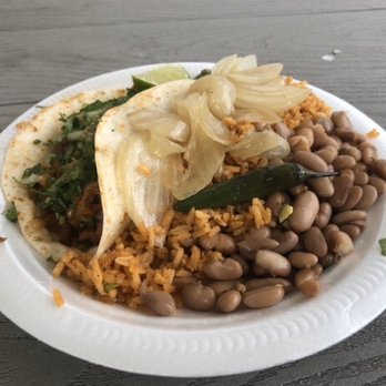 Tacos El Caballo - Taco along with grilled onions and side of rice and beans - Food Trucks Near Me - Detroit, Michigan Tacos El Caballo - Taco along with grilled onions and side of rice and beans - Food Trucks Near Me - Detroit, Michigan