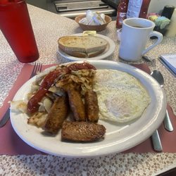 Penn Restaurant - Eggs over easy, home fries with onions, spice sausage, Ginsburg, rye toast, coffee. &10.50. Excellent and even a bargain nowadays.