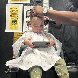 Boulevard Color - My son getting his ears lowered by Lee.